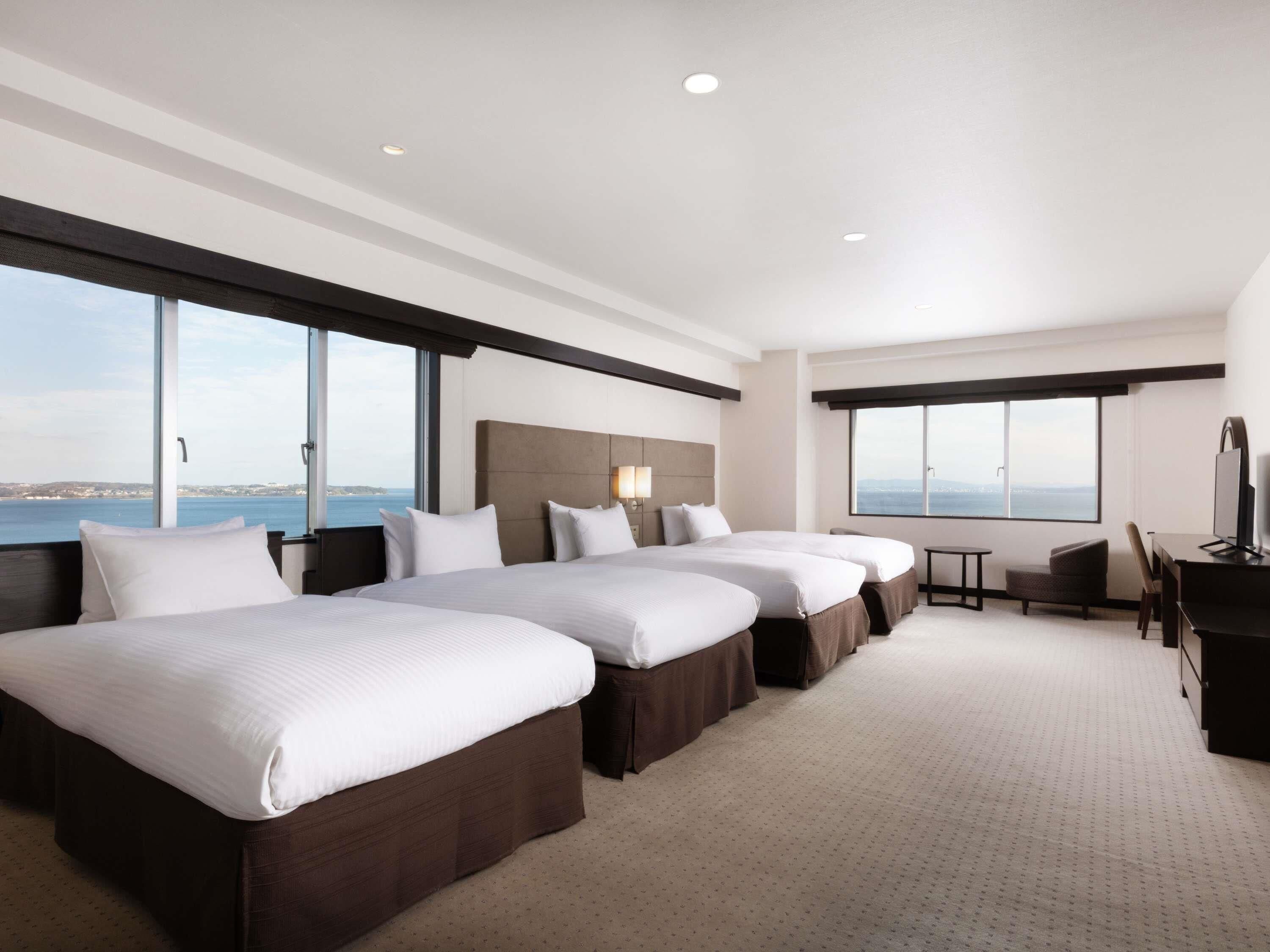 Deluxe Suite, Multiple Beds, Sea View | In-room safe, desk, free WiFi, bed sheets