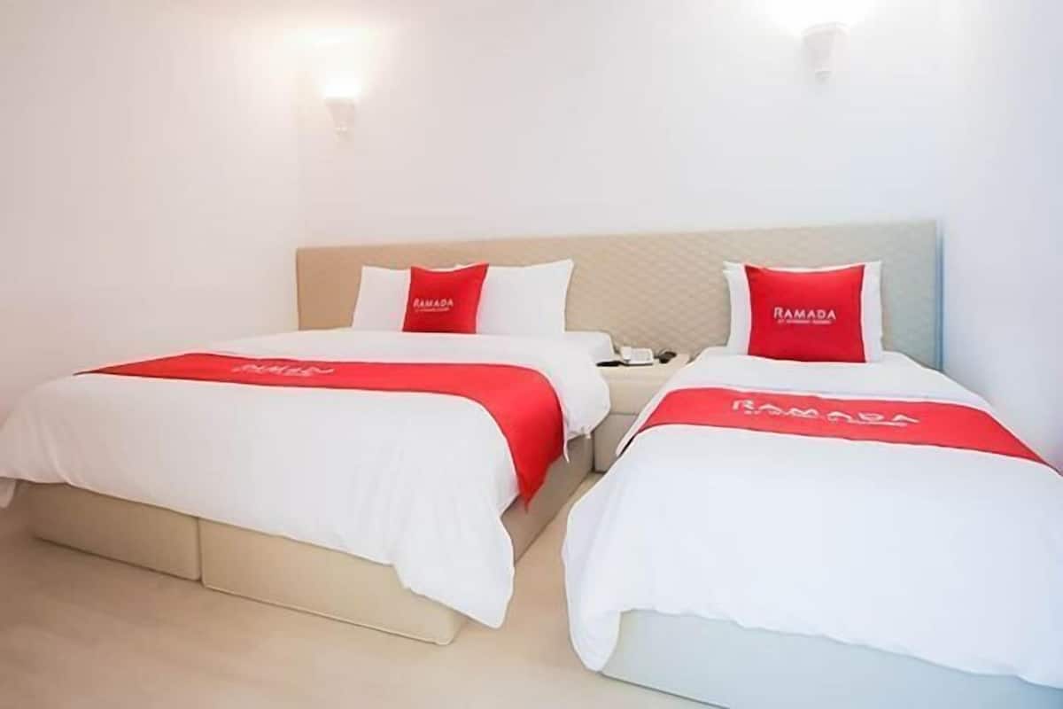 Down comforters, Select Comfort beds, blackout drapes, free WiFi