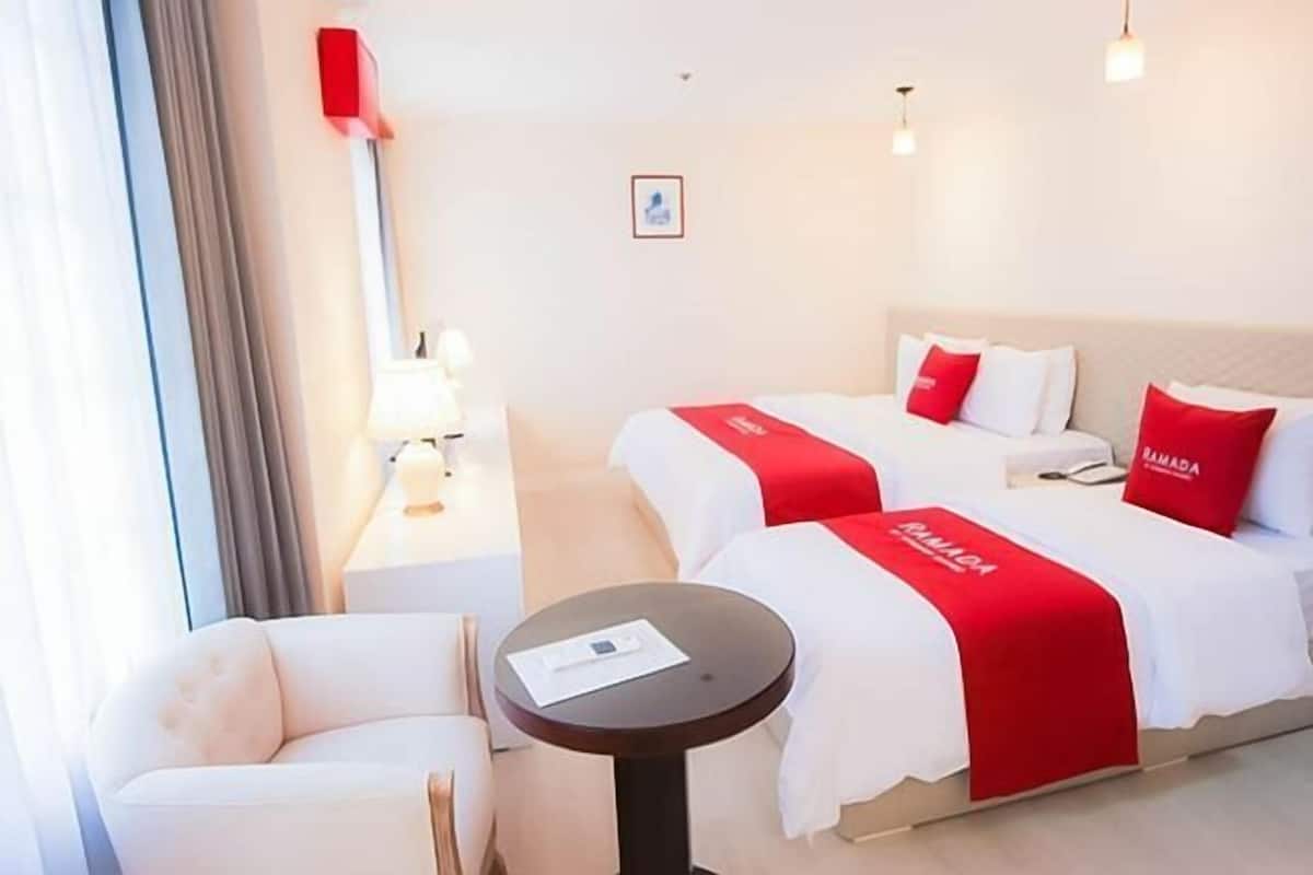 Down comforters, Select Comfort beds, blackout drapes, free WiFi