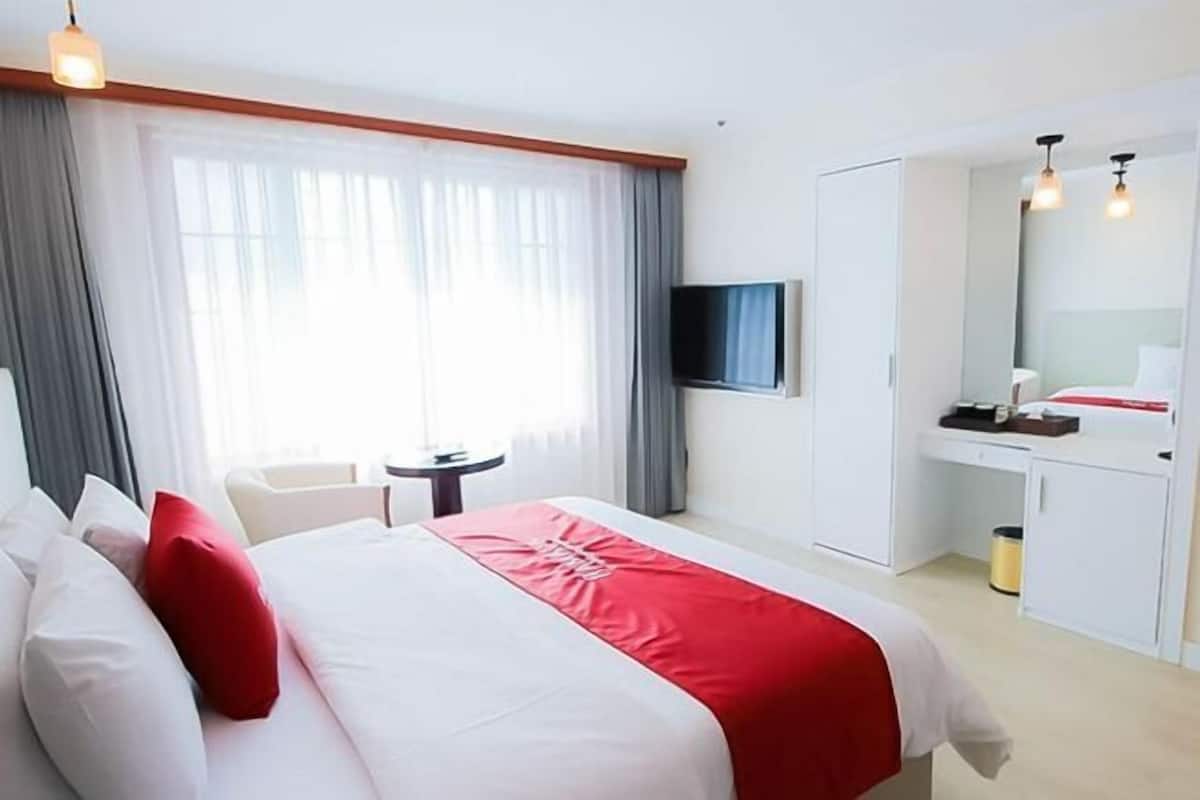 Down comforters, Select Comfort beds, blackout drapes, free WiFi