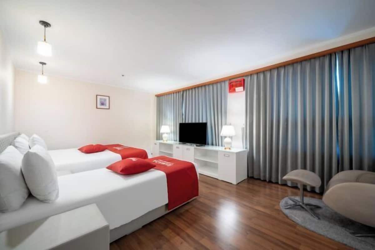 Down duvets, Select Comfort beds, blackout curtains, free WiFi