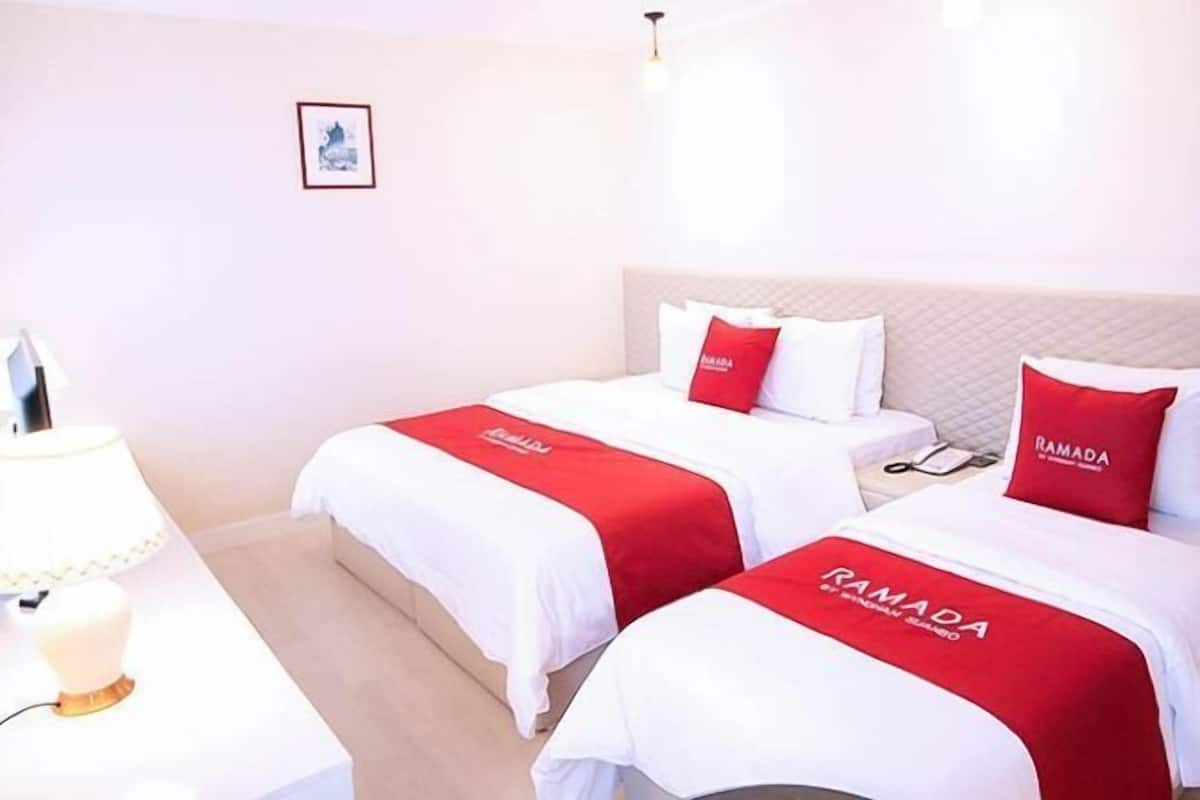 Down comforters, Select Comfort beds, blackout drapes, free WiFi