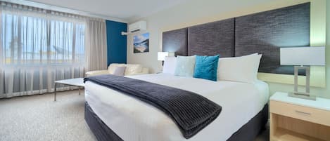 King Suite | 2 bedrooms, individually decorated, individually furnished, desk