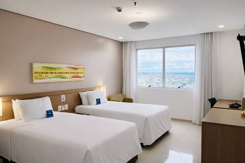 Deluxe Twin Room | Minibar, in-room safe, desk, free WiFi