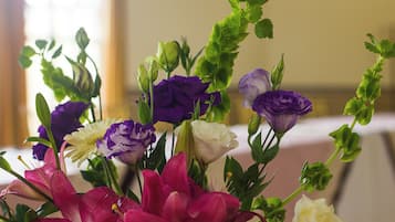 A bouquet of flowers with various colors including purple, white, and pink.