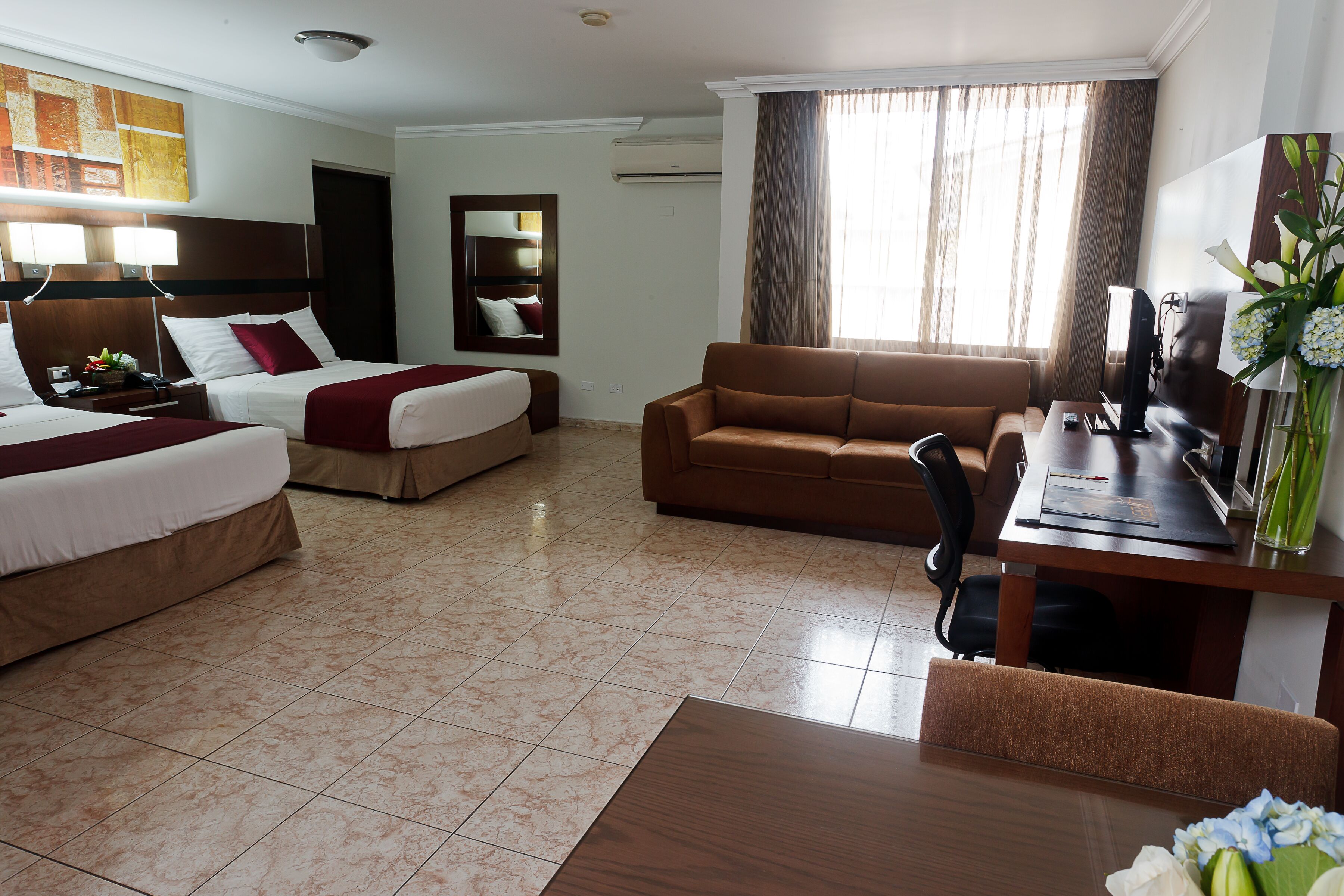 premium suite, 2 double beds | in-room safe, desk, laptop workspace, iron/ironing board