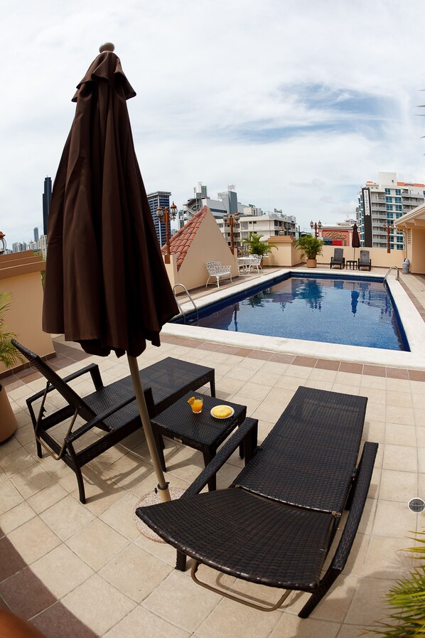 Outdoor pool, open 7:30 AM to 10:00 PM, pool loungers