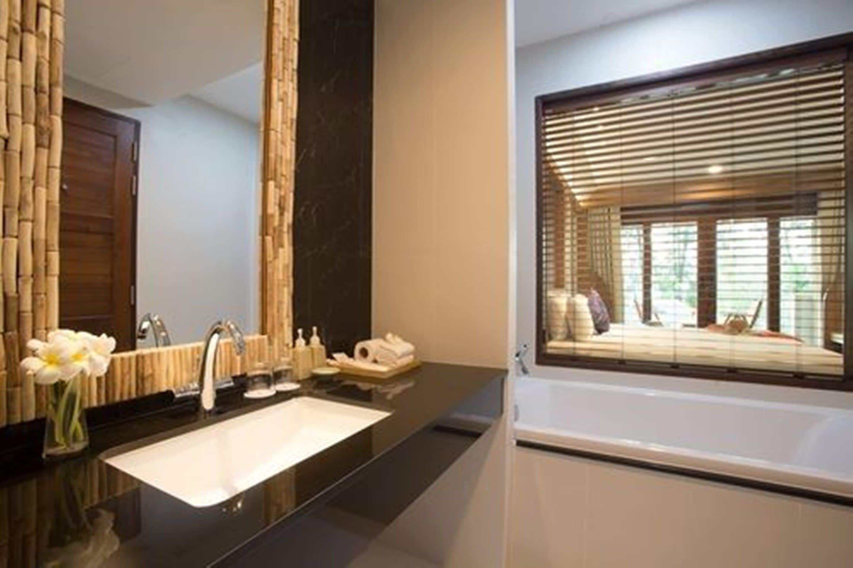 deluxe room, pool view | bathroom sink