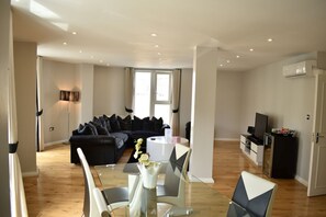 Executive Apartment, 2 Bedrooms (1 Ground Floor - 3 Floor) | Living area | 42-inch TV with satellite channels - Luxlogic (London)