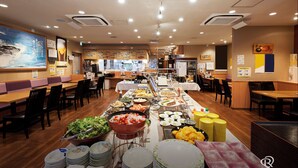 A buffet-style restaurant with multiple dining areas, a variety of food options, and a clean, modern interior. - Daiwa Roynet Hotel Sendai (Sendai)