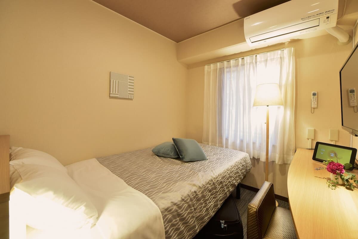 Down duvets, desk, blackout curtains, iron/ironing board