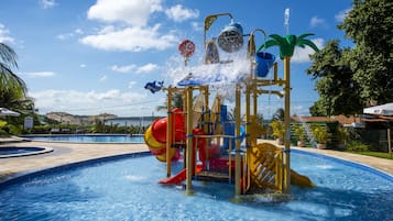 Enjoy a fun-filled day at the pool with a water play area featuring slides and water jets.