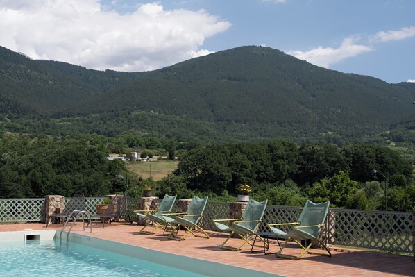 Seasonal outdoor pool, pool umbrellas, sun loungers