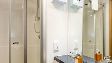Compact Studio | Bathroom | Shower, free toiletries, hair dryer, towels