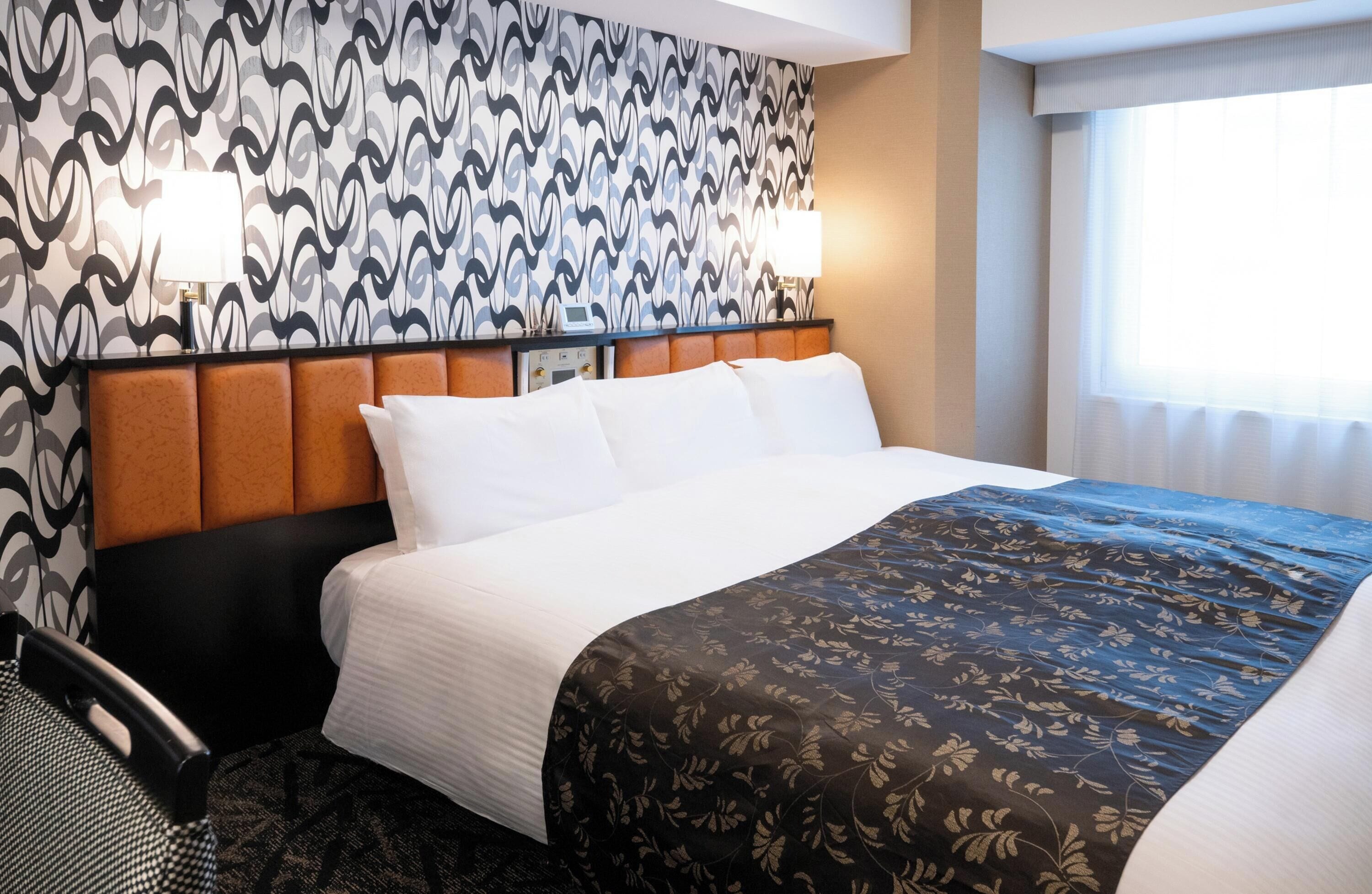 Down comforters, desk, blackout drapes, iron/ironing board