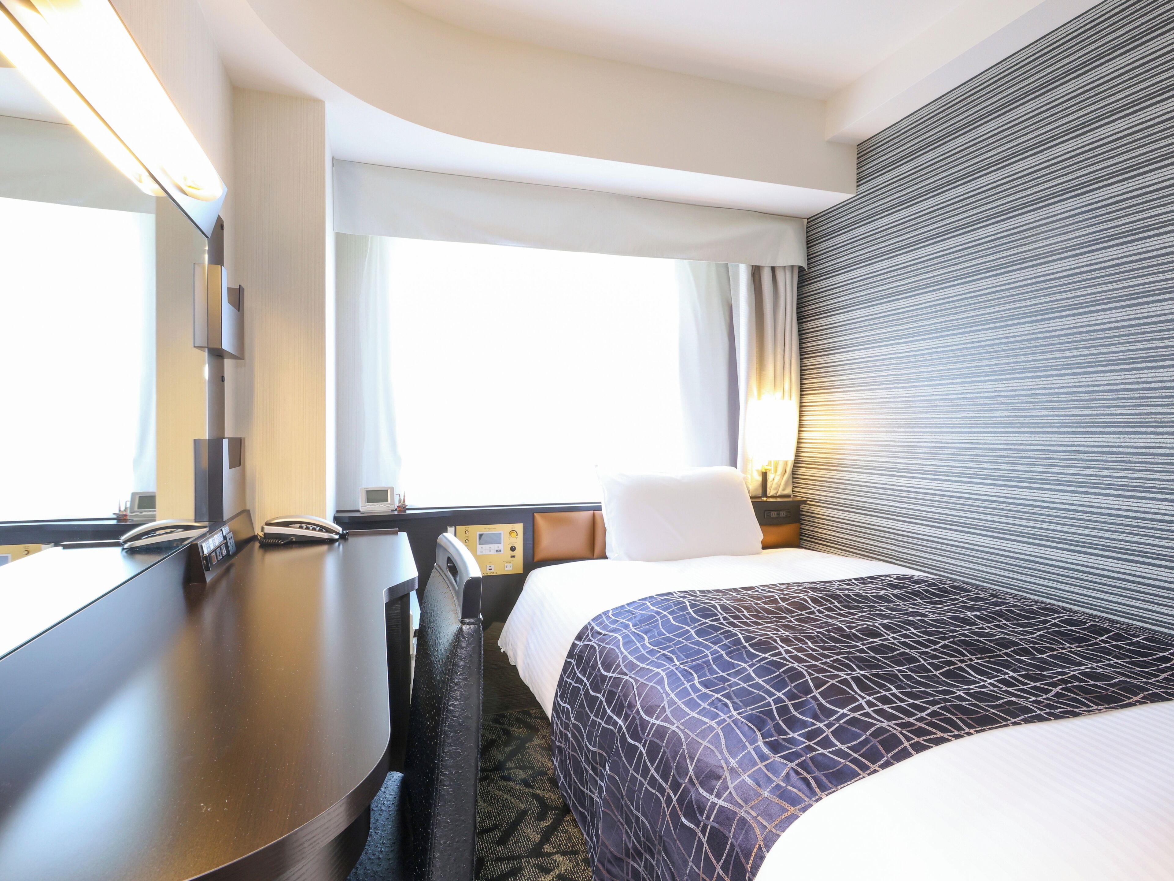 Down comforters, desk, blackout drapes, iron/ironing board