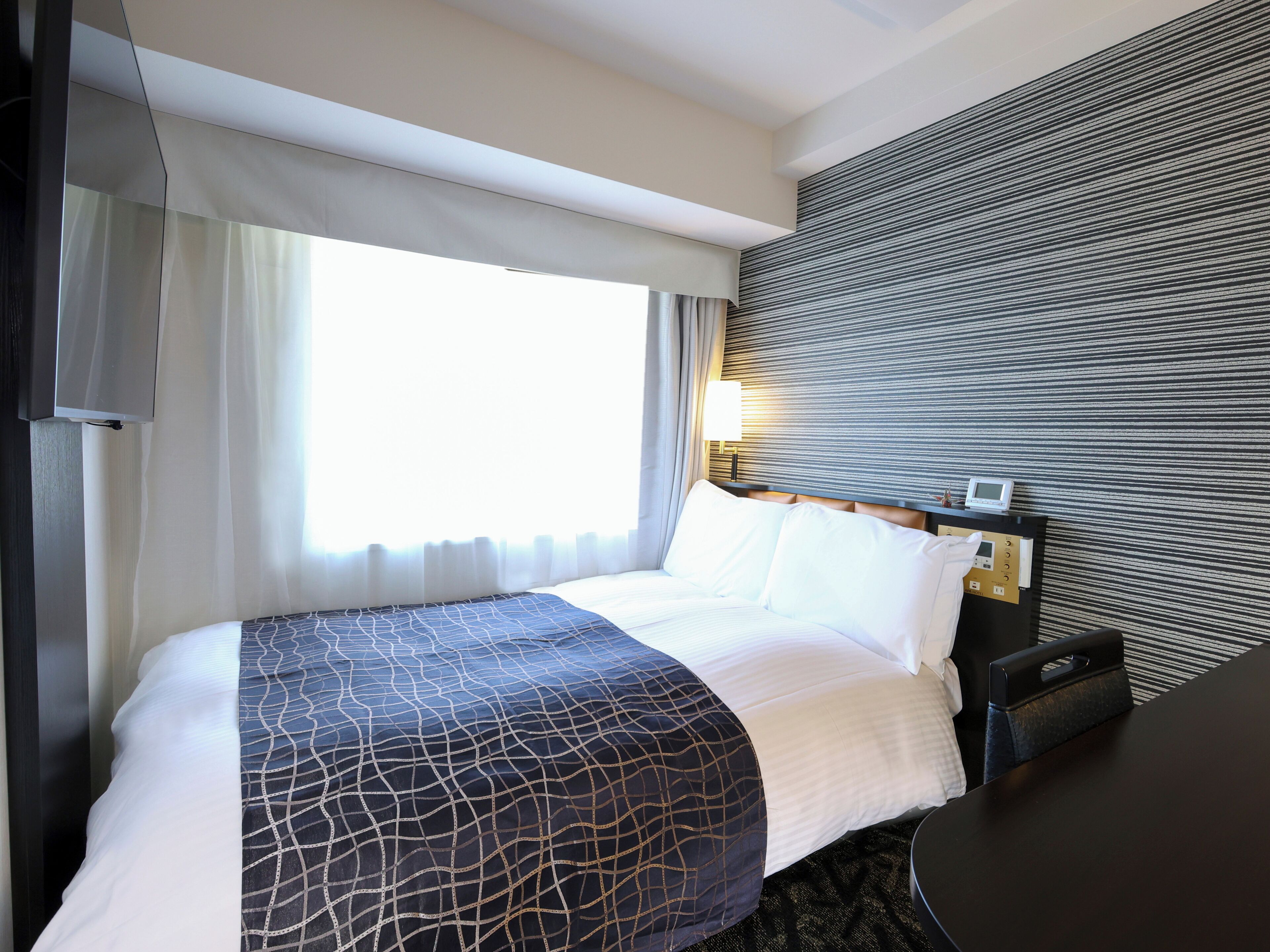 Down comforters, desk, blackout drapes, iron/ironing board