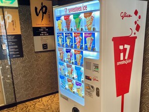 A 7-seater ice vending machine with various ice cream flavors. - APA Hotel Osaka Temma (Osaka)
