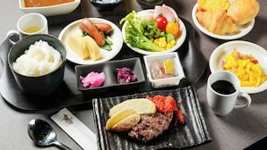 A variety of dishes including rice, sausages, salad, and a meat dish, suggesting a diverse meal option. - APA Hotel Osaka Tanimachi 4chome Ekimae Kita (Osaka)