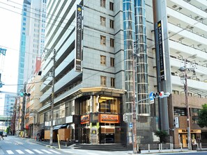 A hotel with multiple floors, large windows, and a prominent sign. - APA Hotel Osaka Tanimachi 4chome Ekimae Kita (Osaka)