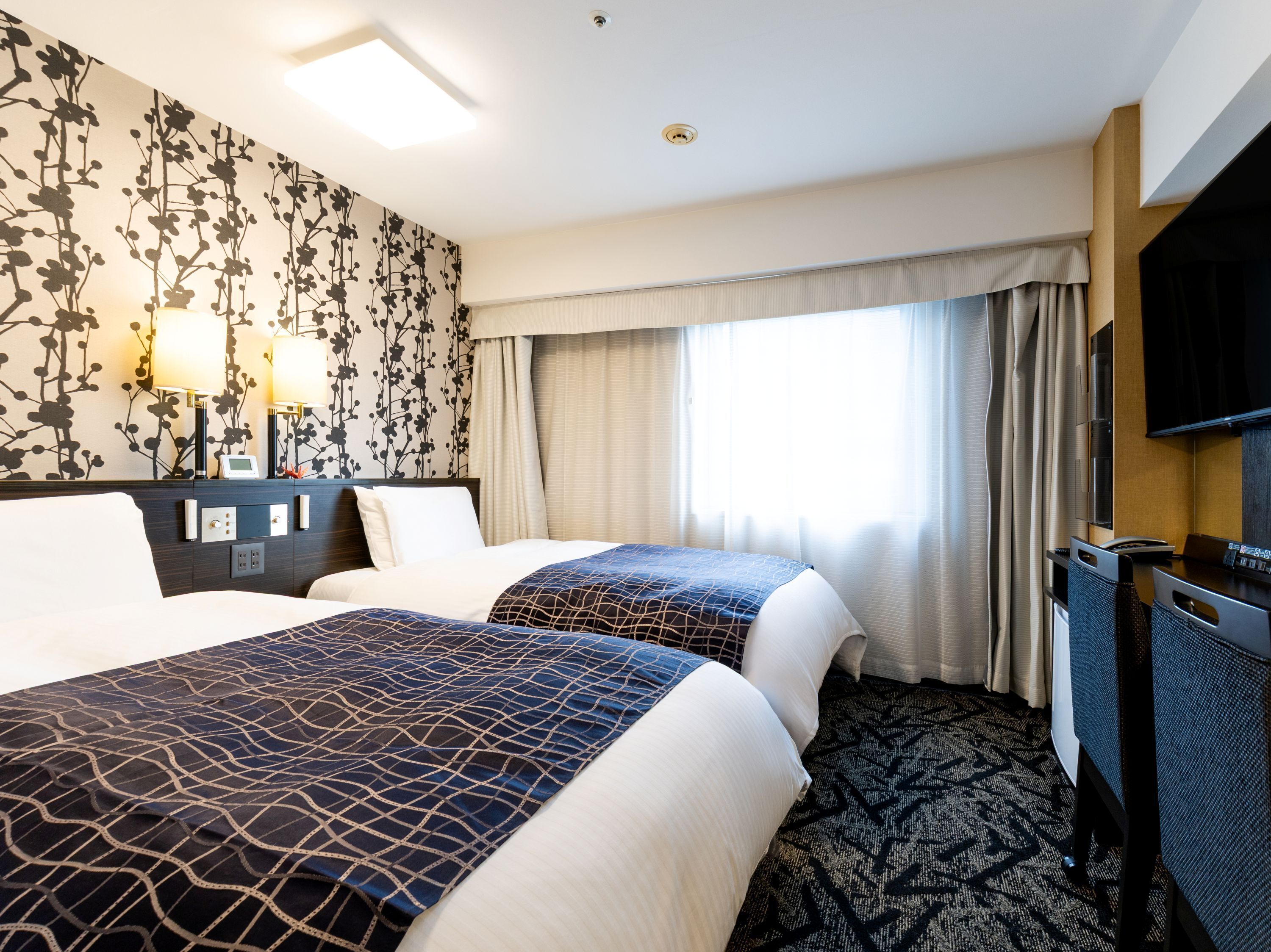 Premium bedding, down duvets, in-room safe, desk