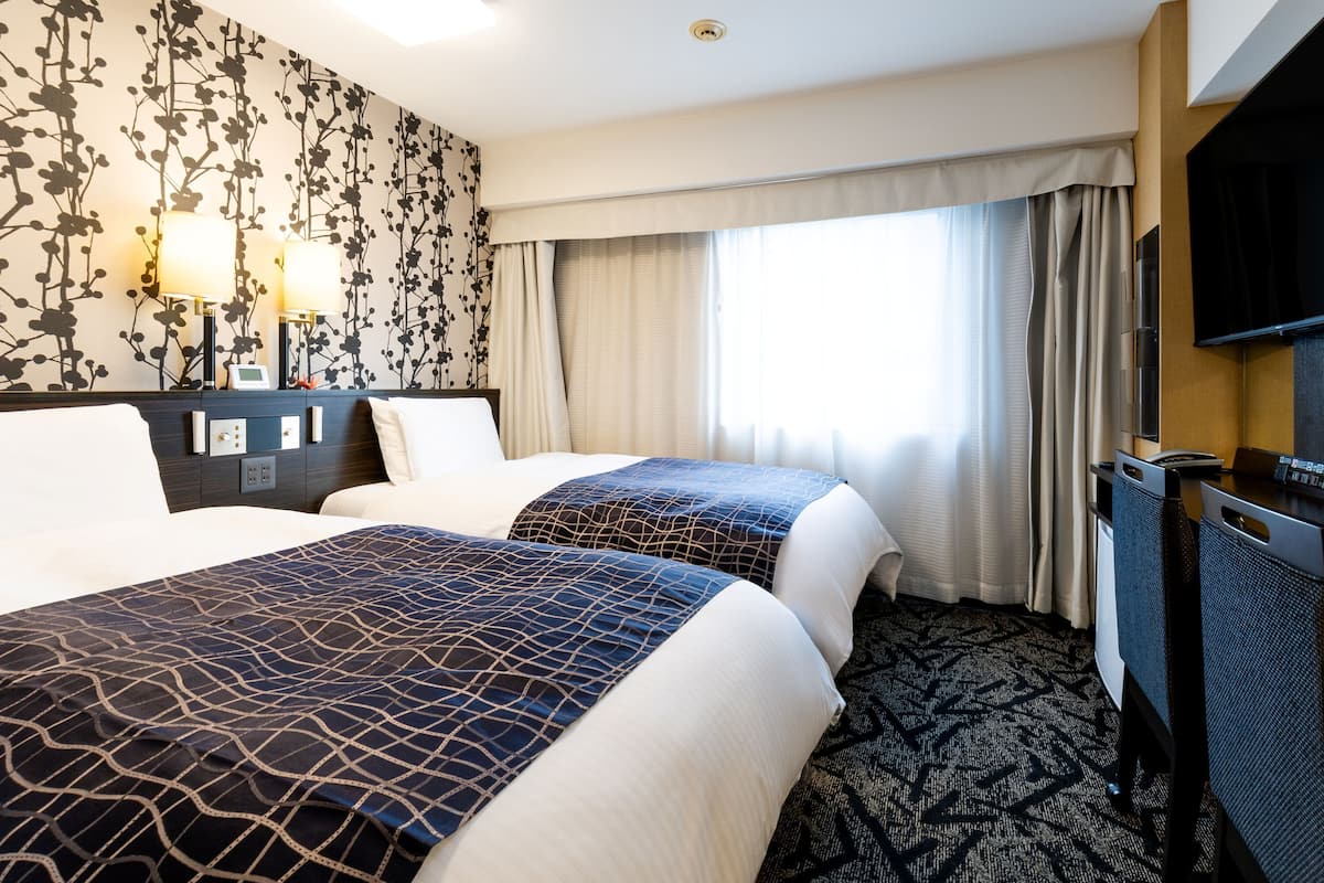 Premium bedding, down duvets, in-room safe, desk