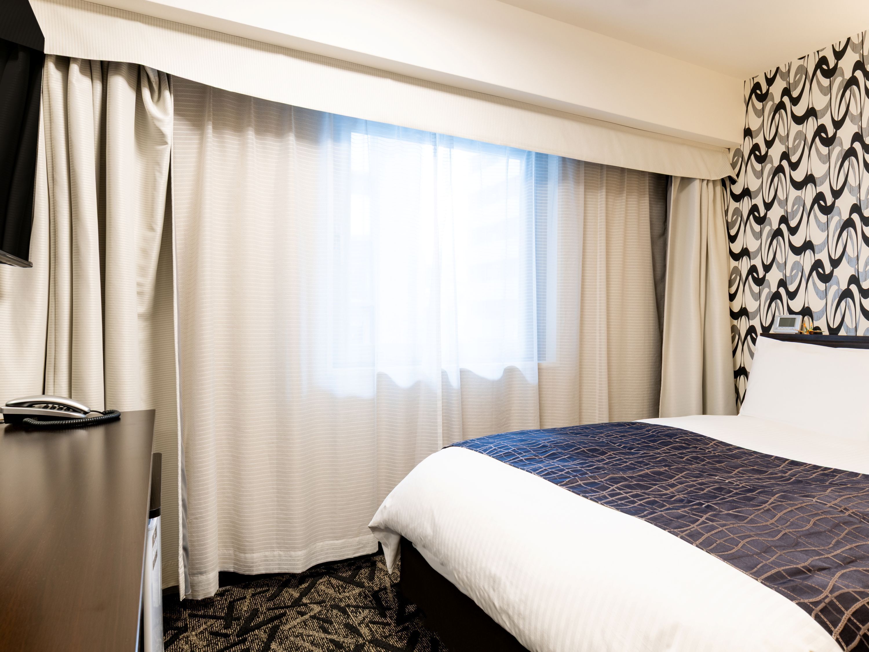 Premium bedding, down duvets, in-room safe, desk