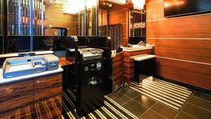 A modern hotel bathroom with a large mirror, a sink, a vanity, and a towel rack. - APA Hotel Tennoji Ekimae (Osaka)