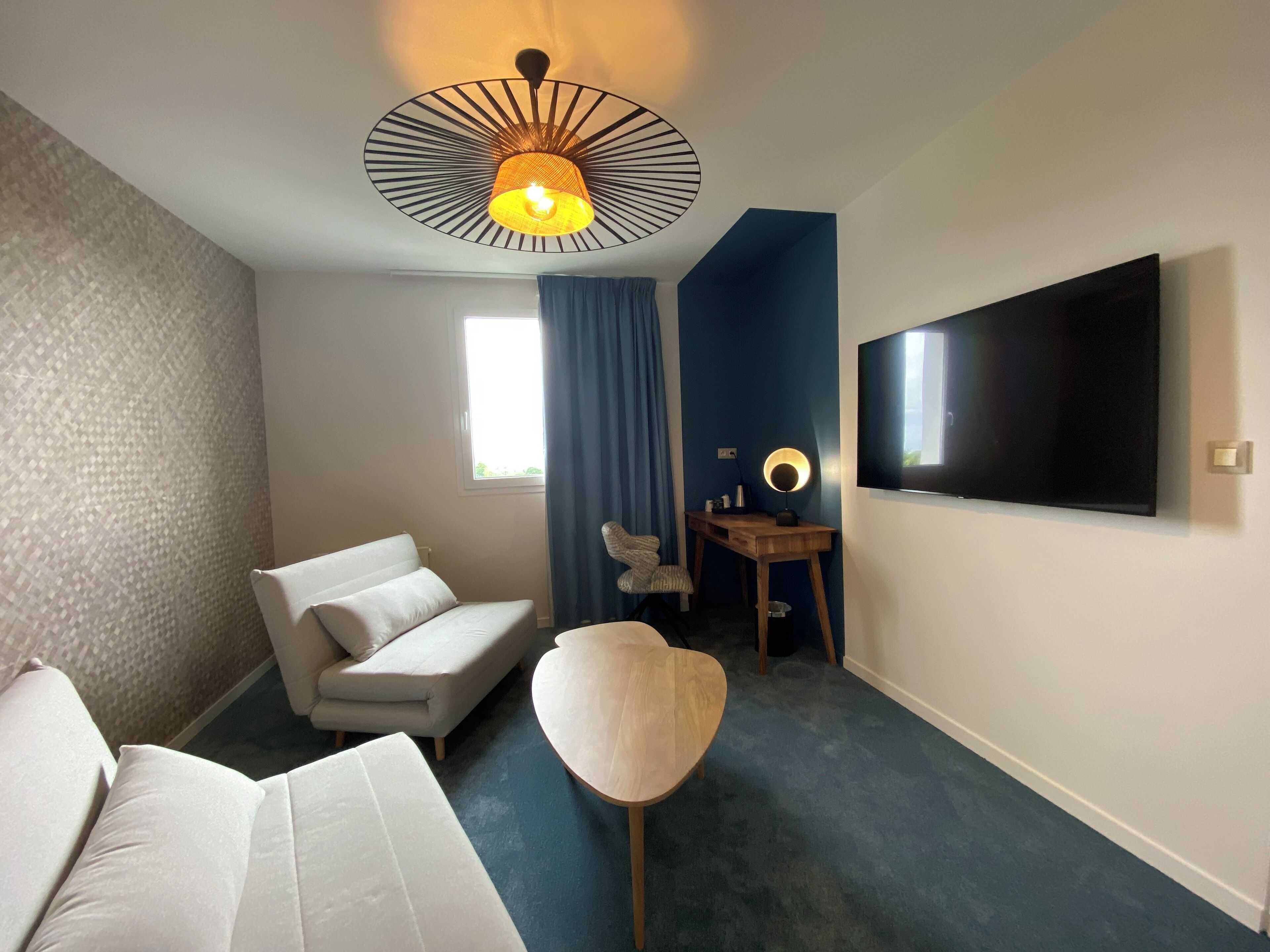 family room | premium bedding, desk, blackout curtains, soundproofing