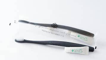 Two toothbrushes with packaging.