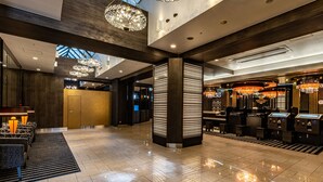 A modern hotel lobby with high ceilings, chandeliers, and a reception area. - APA Hotel Kyoto Eki Horikawadori (Kyoto)