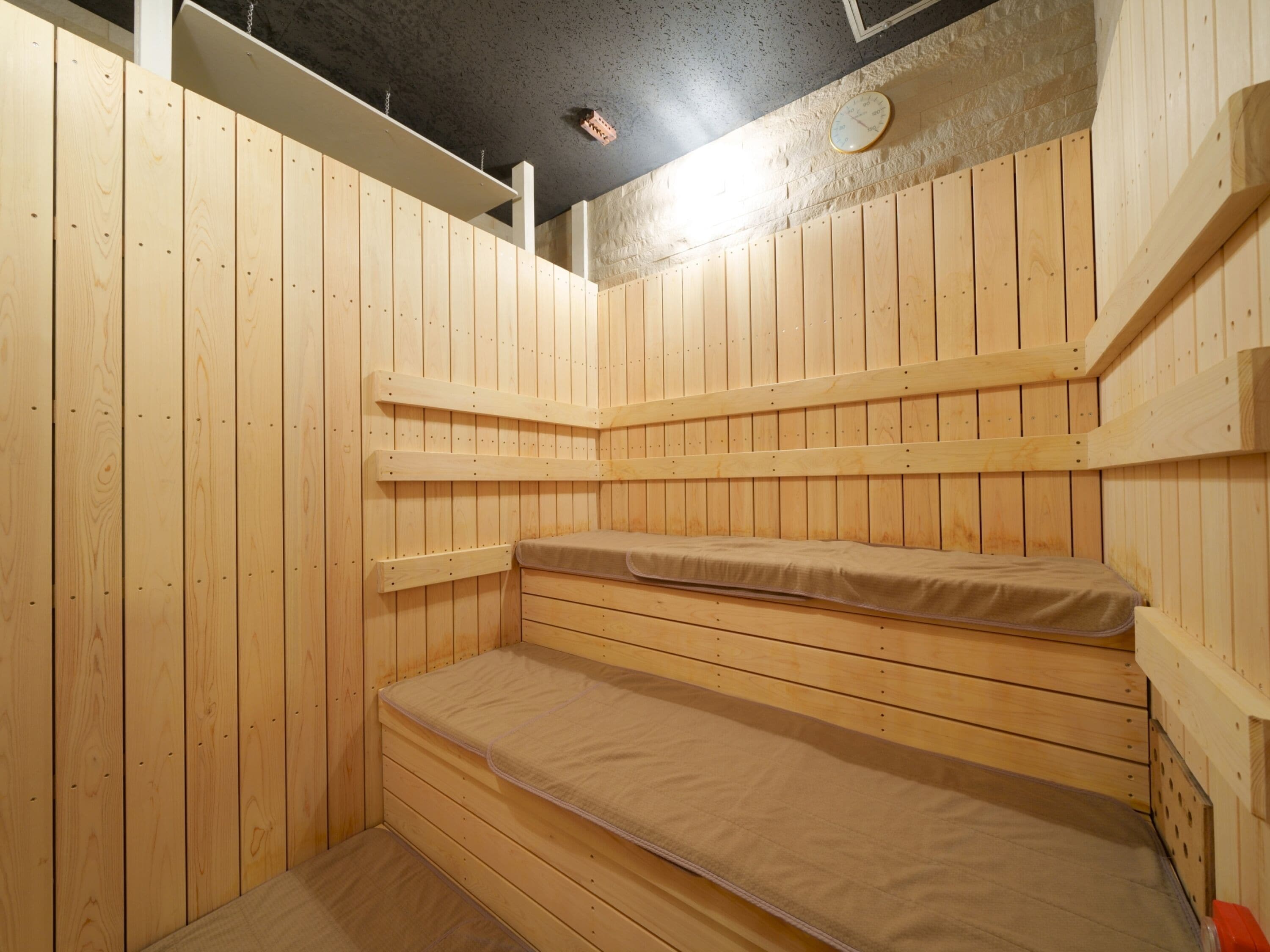 A sauna with wooden walls and benches.