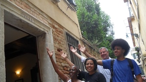 A narrow street with buildings on either side. - Santa Margherita Guesthouse (Venice)