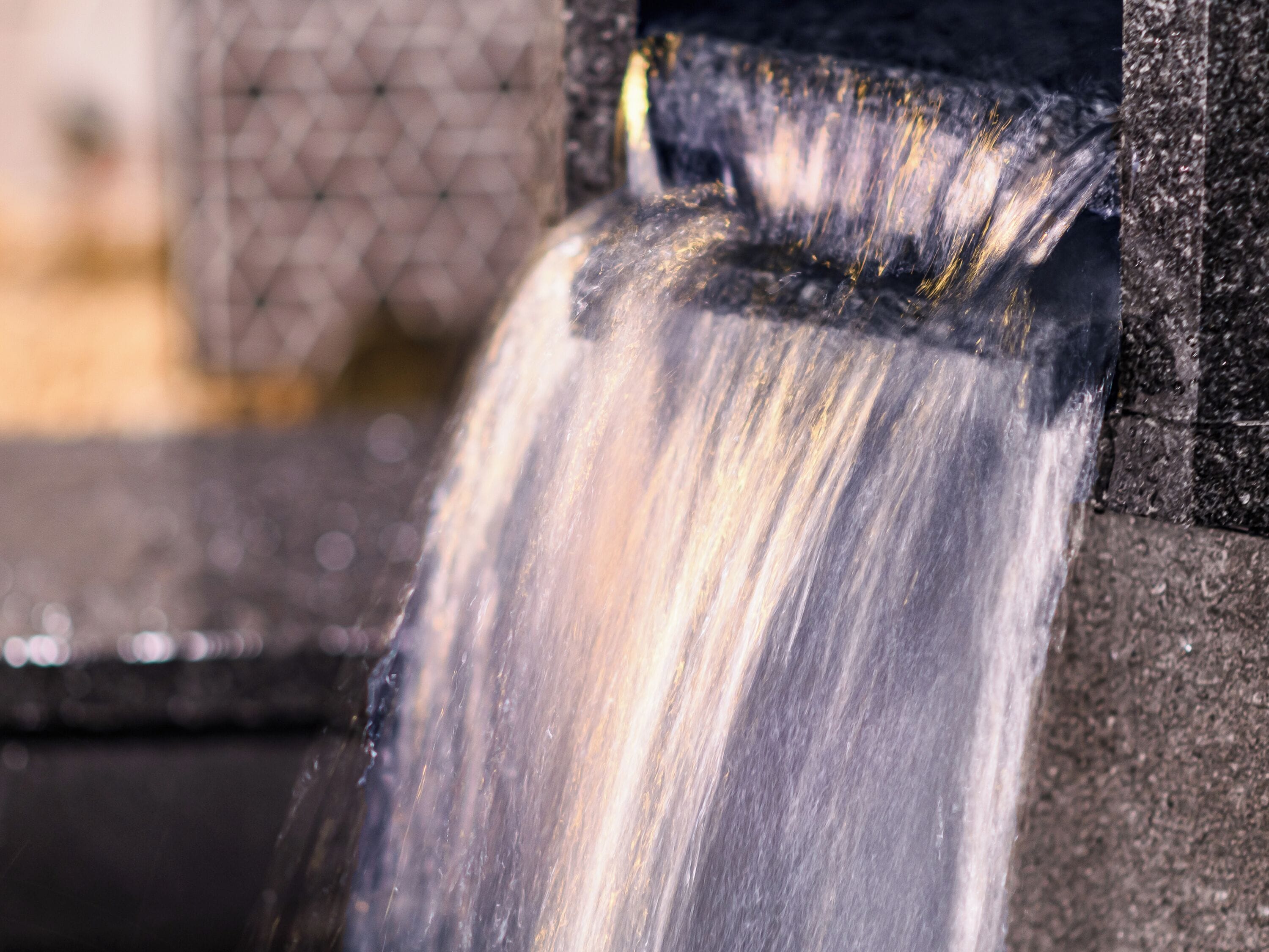 A close-up of a waterfall feature, likely part of a water fountain or decorative element.