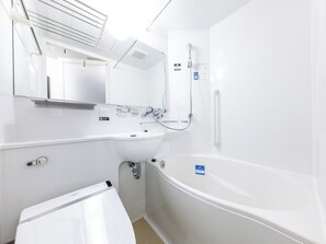 Combined shower/tub, free toiletries, hair dryer, slippers