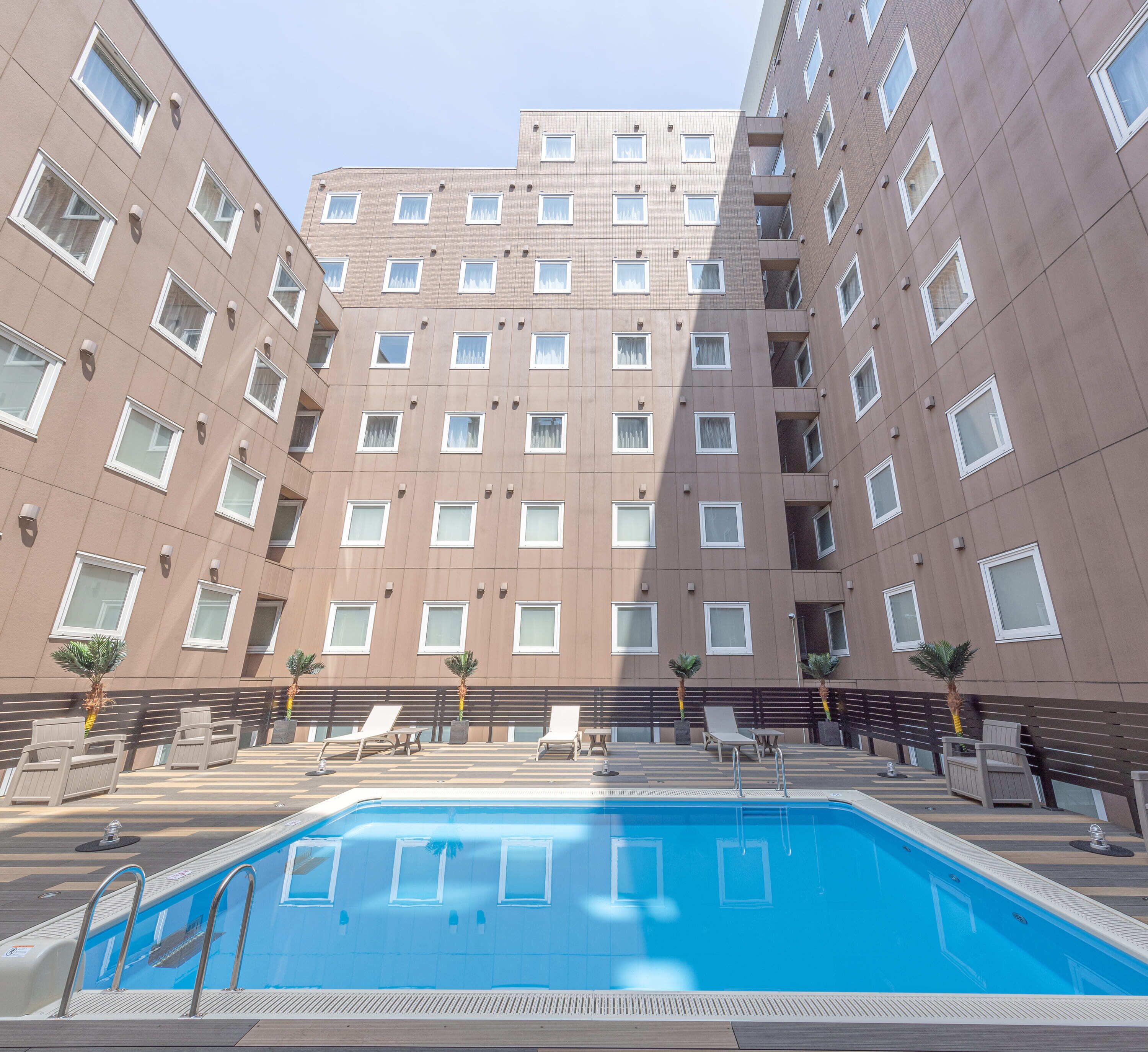 seasonal outdoor pool, open 9:00 am to 9:00 pm, pool umbrellas