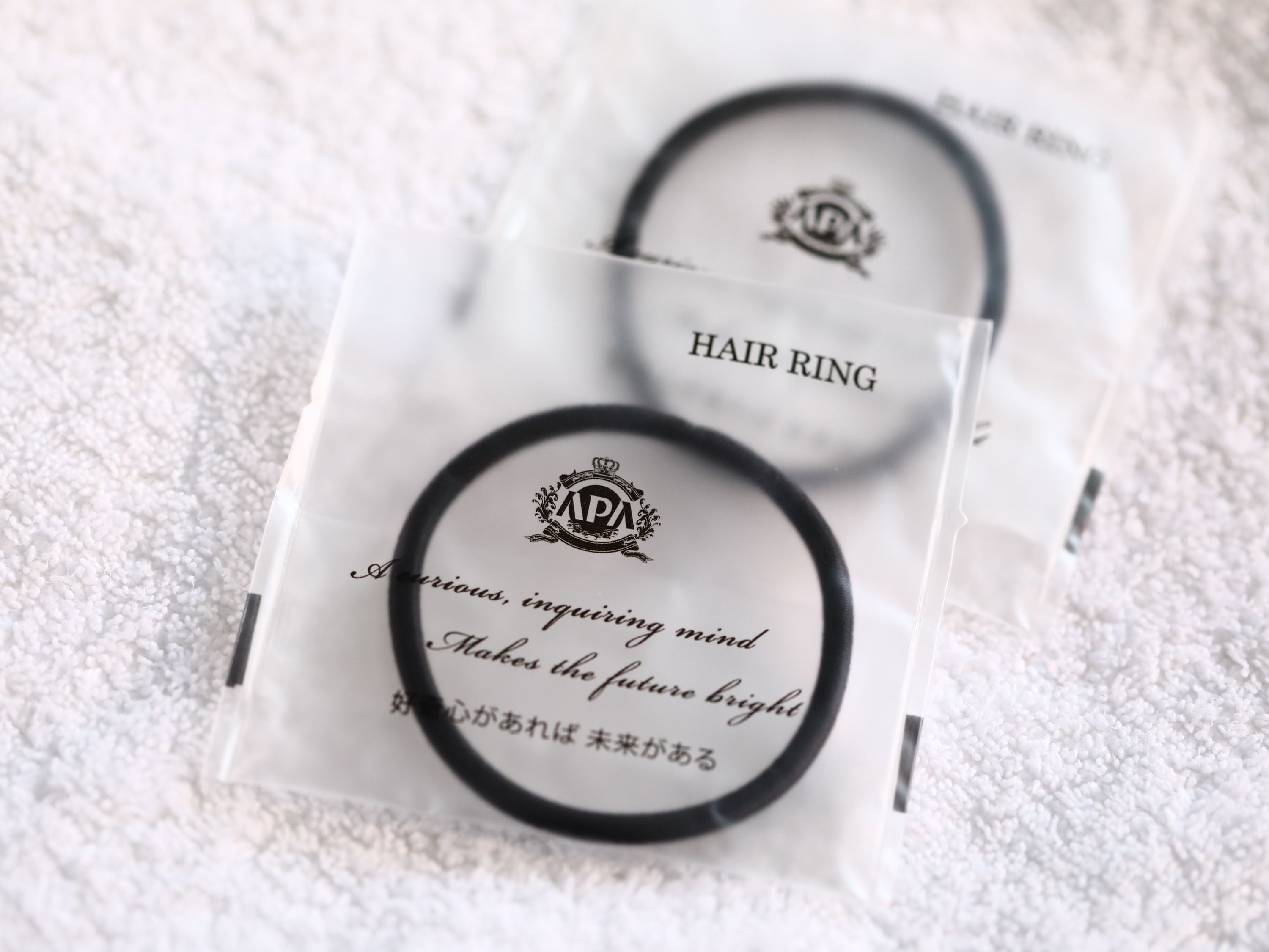 A hair ring package with text on it.