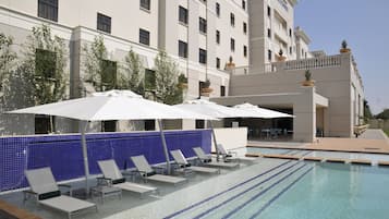 Outdoor pool, open 5 PM to 6 PM, pool umbrellas, pool loungers
