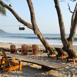 On the beach, surfing