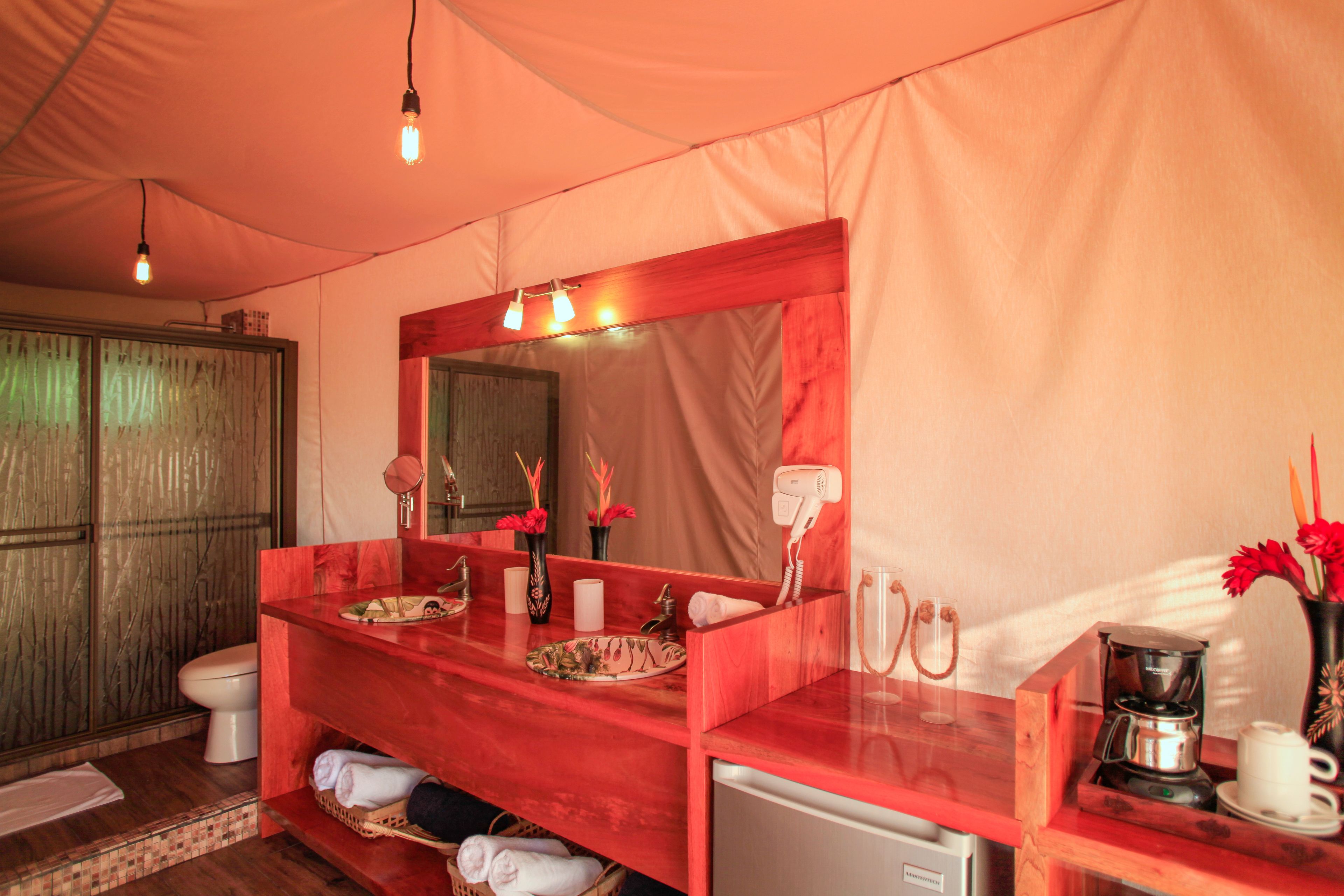 beachfront glamping junior suite | bathroom | hair dryer, towels