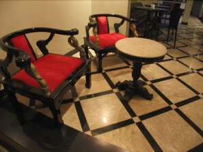 Sit comfortably in the dining area with two chairs and a round table.
