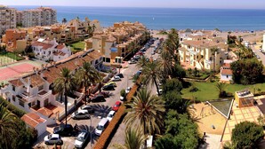 A coastal residential area with a swimming pool, tennis courts, and a beach. - Apartamentos Euromar Playa (Torrox)