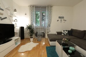 Standard Apartment, 2 Bedrooms, Terrace, Garden View | Living room | Flat-screen TV