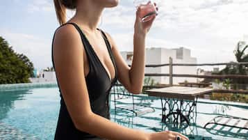 Outdoor pool, pool umbrellas, sun loungers