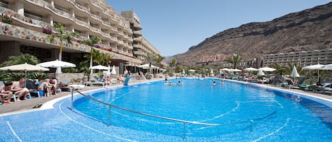 Indoor pool, outdoor pool, pool umbrellas, pool loungers