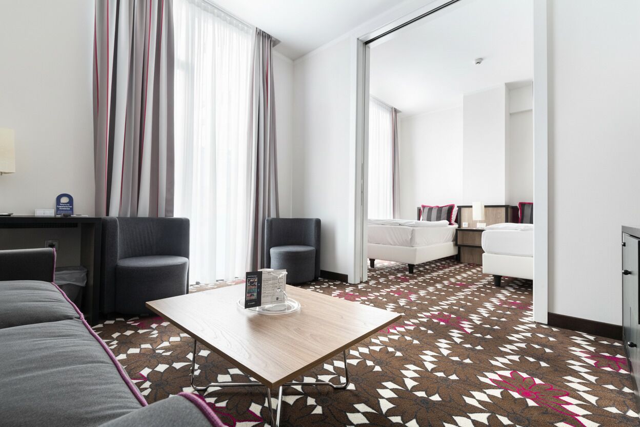 Superior Suite | Living area | Flat-screen TV, toys