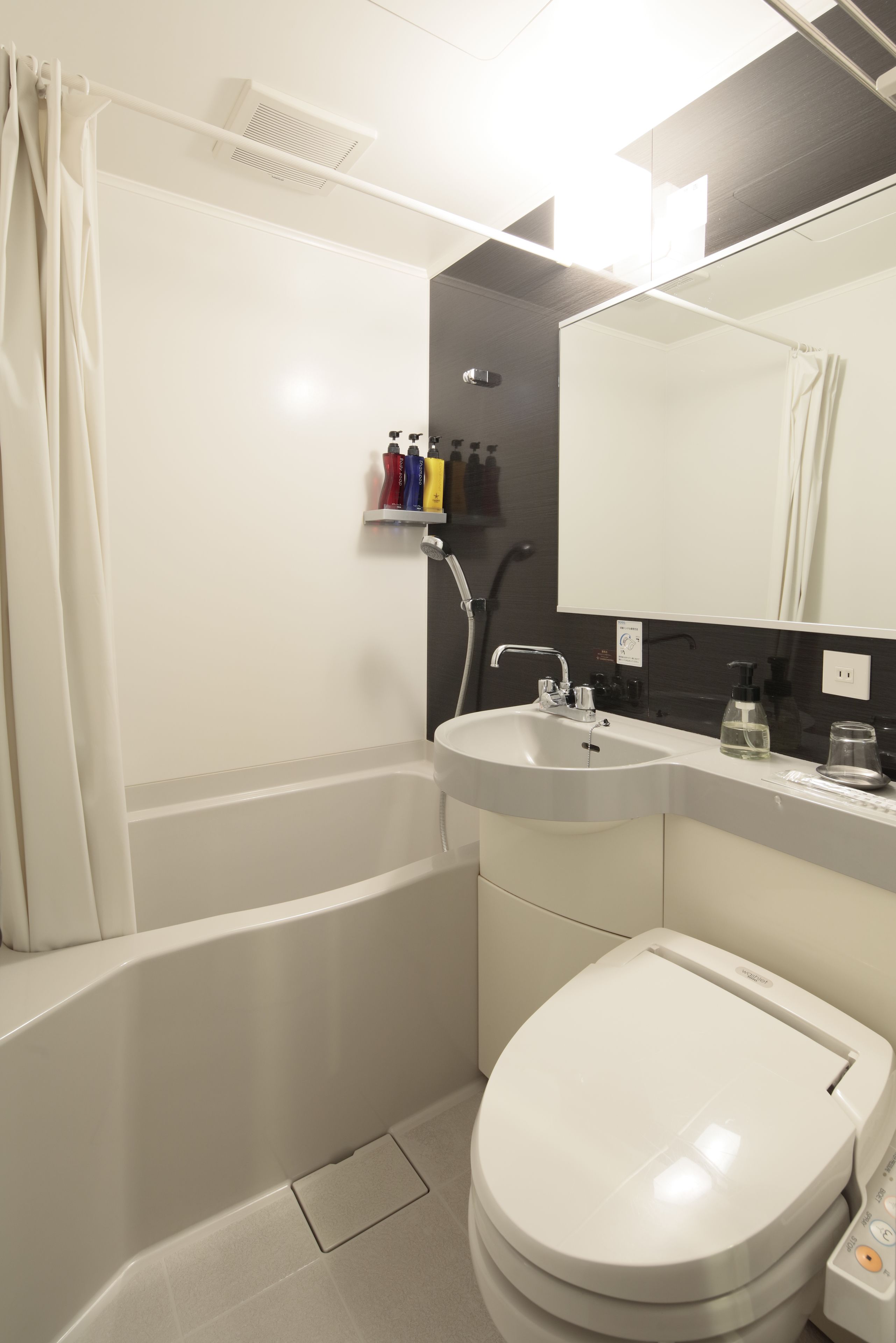 combined shower/bathtub, free toiletries, hair dryer, slippers