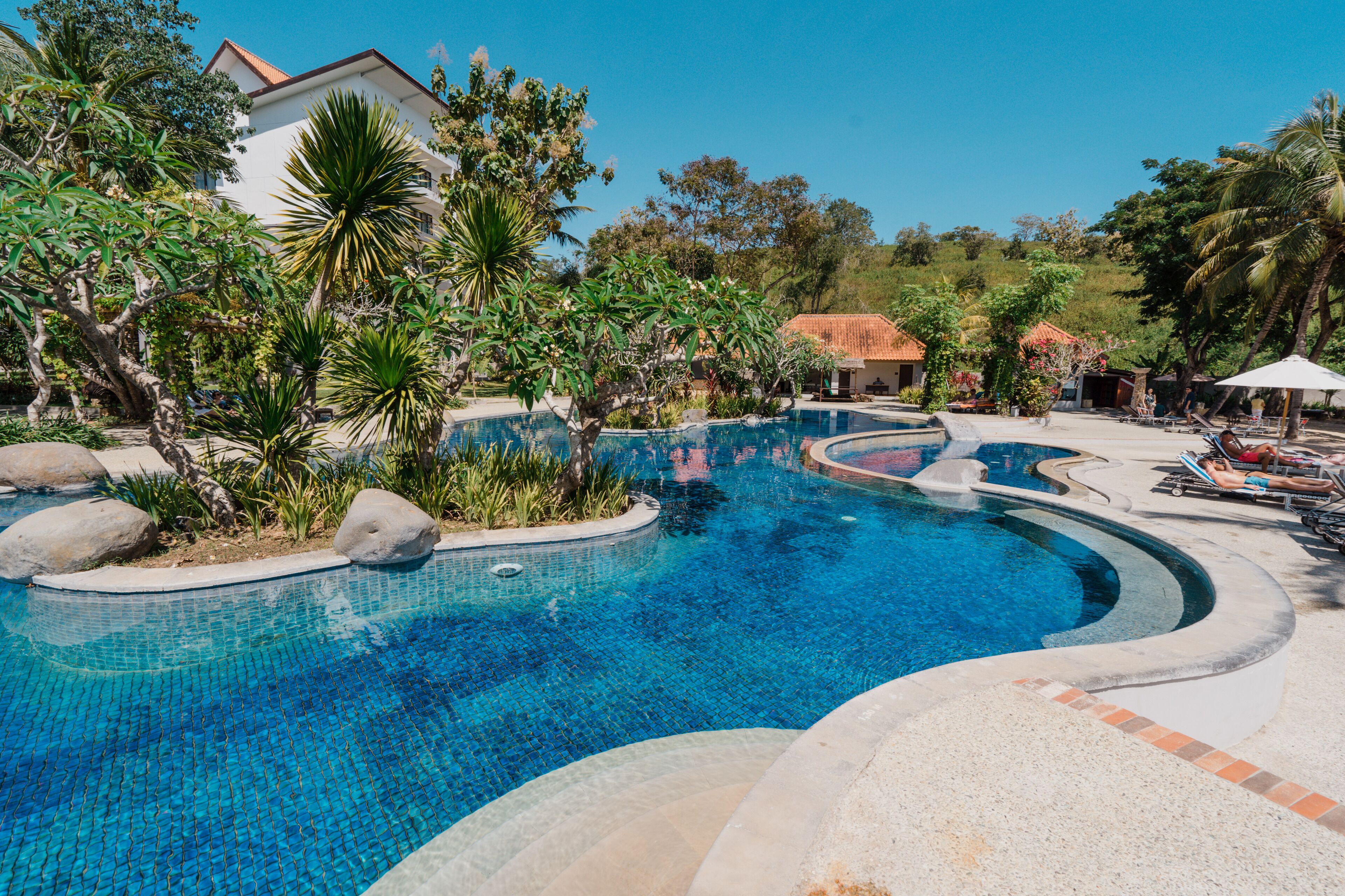 outdoor pool, pool umbrellas, pool loungers