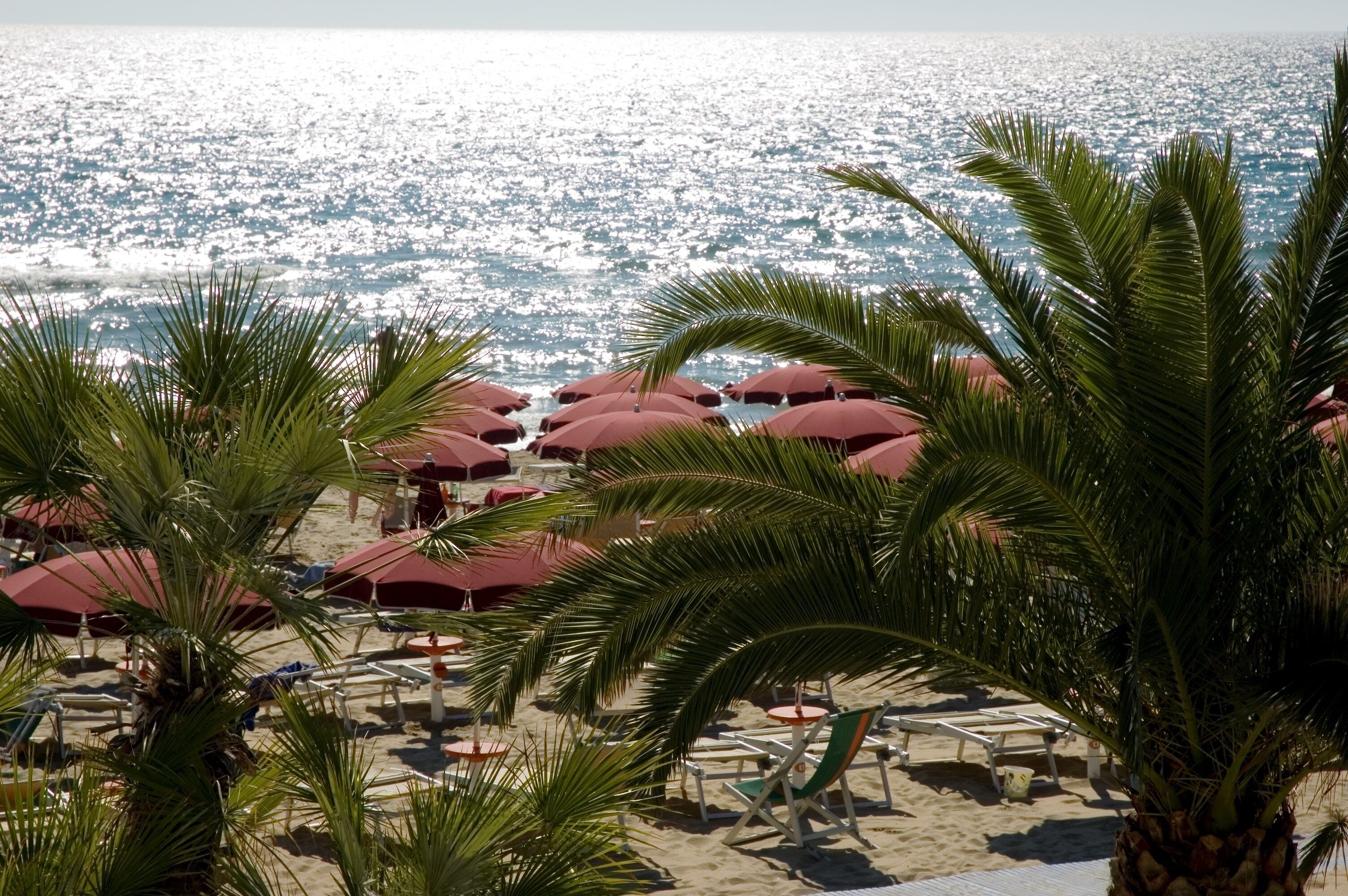 On the beach, sun loungers, beach umbrellas, beach towels