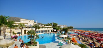 On the beach, sun loungers, beach umbrellas, beach towels